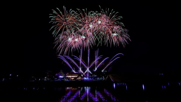 fireworks over the temple in the dark sky photo