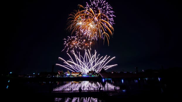 fireworks over the temple in the dark sky photo