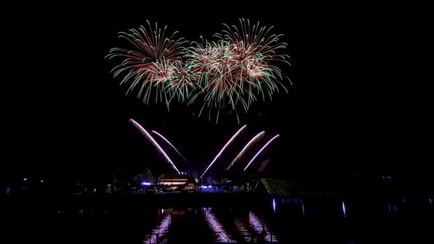 fireworks over the temple in the dark sky photo