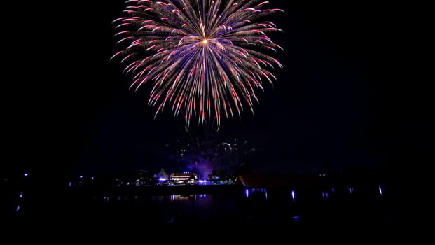 fireworks over the temple in the dark sky photo