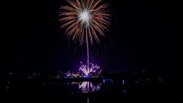 fireworks over the temple in the dark sky photo