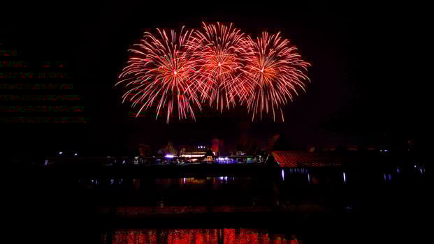 fireworks over the temple in the dark sky photo