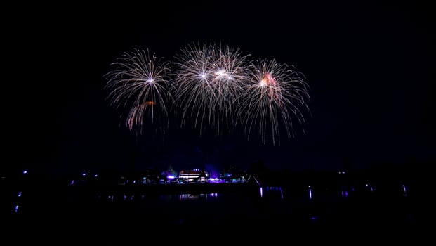 fireworks over the temple in the dark sky photo