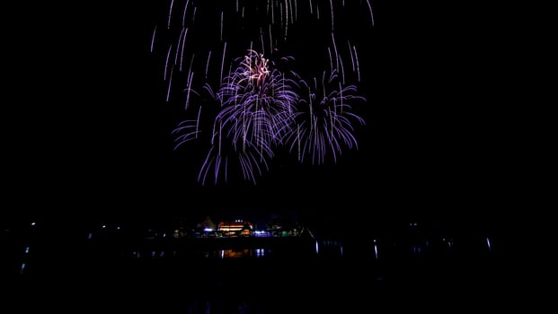 fireworks over the temple in the dark sky photo