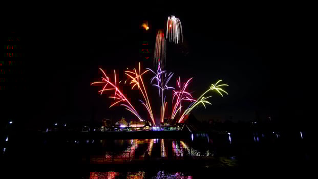 fireworks over the temple in the dark sky photo