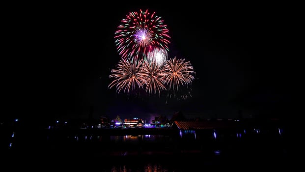 fireworks over the temple in the dark sky photo