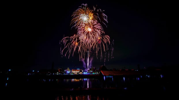 fireworks over the temple in the dark sky photo