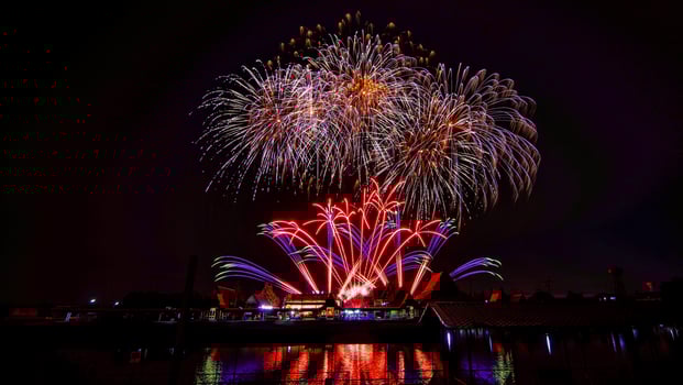 fireworks over the temple in the dark sky photo
