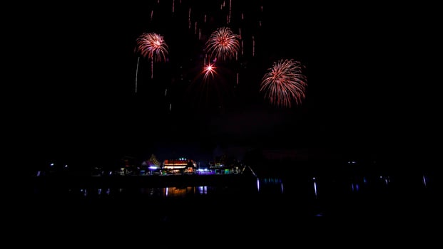 fireworks over the temple in the dark sky photo