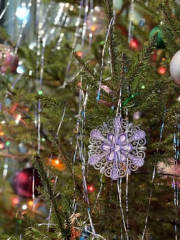 Christmas tree decorated with toys and lights photo