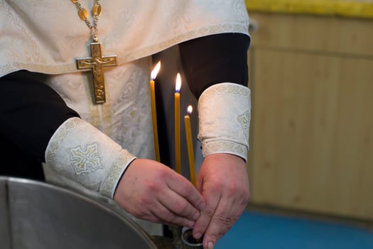 The rite of baptism. Priest prepare to baptize the child. Font for taking faith.The hands of the priest near the Epiphany bath photo