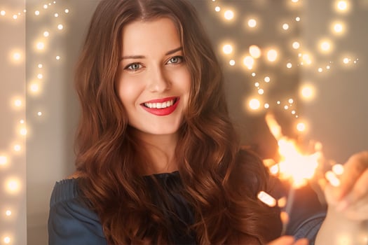 Holiday magic, Christmas and New Year celebration, happy woman with sparklers photo