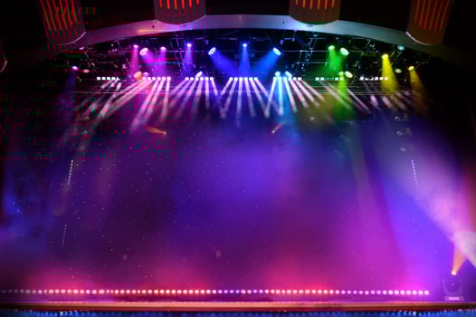 Elegant theater stage with colored lights and smoke photo