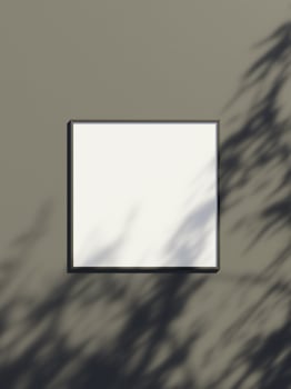 Blank frame mockup hanging on the wall with leaf shadow photo
