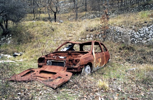 Rustic Remains Abandoned Wreckage of a Crashed Car photo