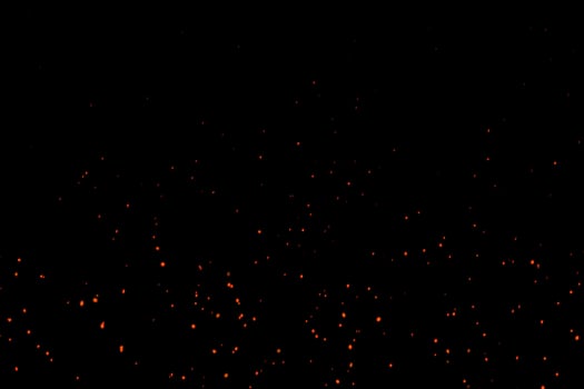 Horizontal Beautiful Burning Hot Sparks Rising from small red Fire in dark Night. Abstract alpha Isolated Fire Glowing Particles on Black Background.Slow Motion. Looped Animation. Moving Side.4K photo