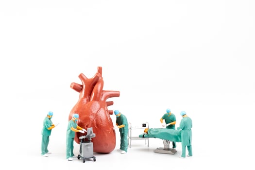 Doctor and nurse medical team are performing surgical operation at emergency room photo