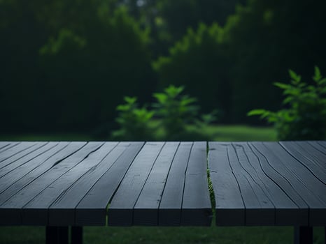 Wooden table and blur tropical green grass background, product display montage. High quality photo 8k FHD AI generated