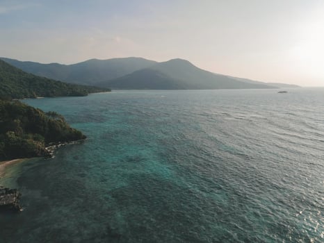 Aerial view of Karimunjawa Islands, Jepara, Indonesian archipelago, Volcano Island, coral reefs, white sand beaches. Top tourist destination, best diving snorkelling. photo