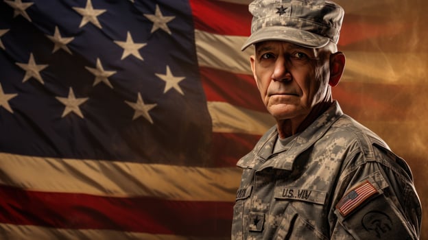 An elderly male soldier in military uniform standing in front of an american flag photo