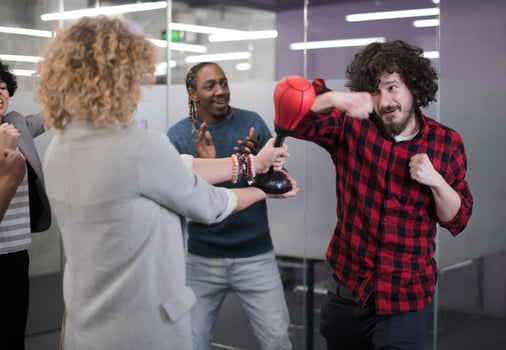 multiethnics business team boxing at office photo