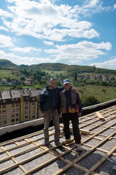Construction worker installing a new roof photo