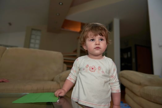 Adorable cute beautiful little baby girl playing with toys at home photo
