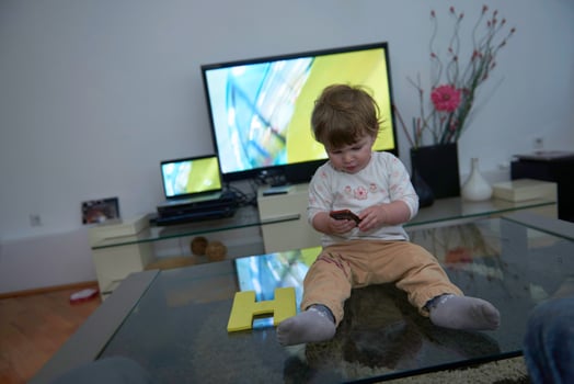 Adorable cute beautiful little baby girl playing with toys at home photo