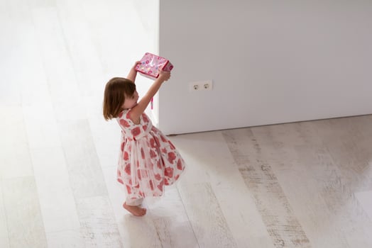 little girl enjoying while playing with mother's jewelry photo