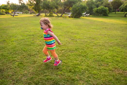 little girl spending time at backyard photo