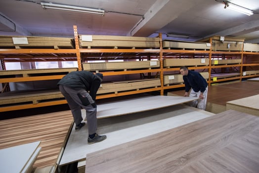 two young carpenters working in big modern carpentry photo