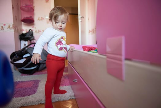 cute  little one year old baby and making first steps photo