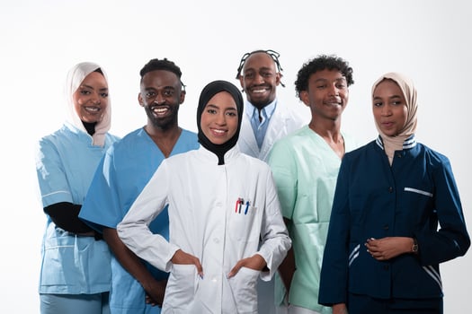 Team or group of a doctor, nurse and medical professional coworkers standing together. Portrait of diverse healthcare workers looking confident. Middle Eastern and African, Muslim medical team. photo