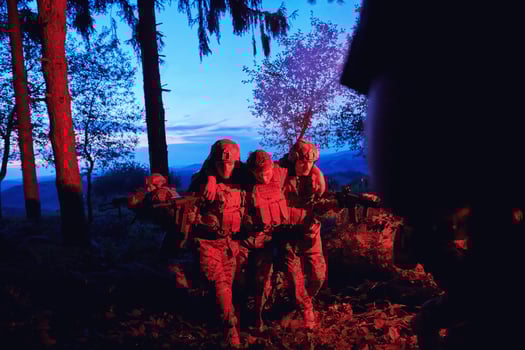 military squad in action rescue wounded soldier photo