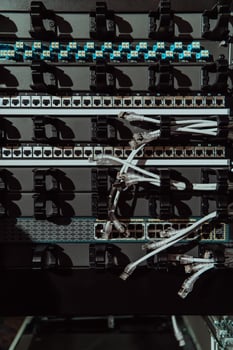 Close up of technician setting up network in server room photo