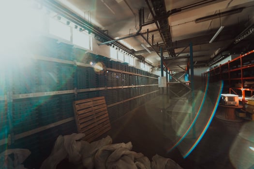 Gold mining storage rock core samples geology drilling industy. Large ore warehouse in modern industry, ores stacked in boxes. Selective focus photo