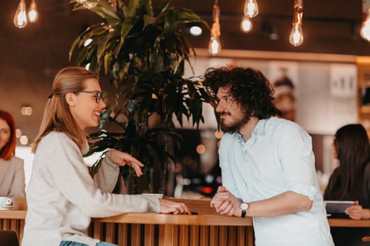 Business couple sits in a cafe after a weekday. photo