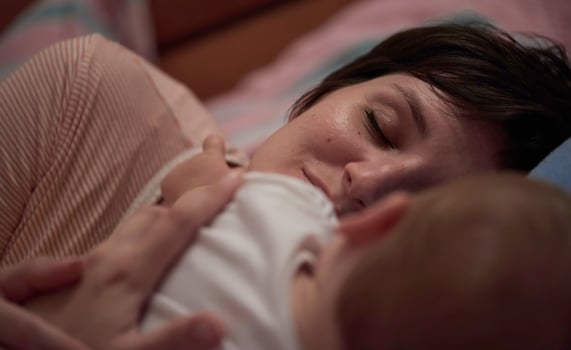 mother is playing with baby at home photo