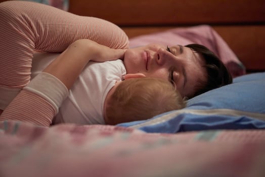 mother is playing with baby at home photo