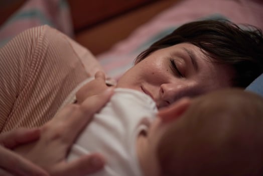 mother is playing with baby at home photo