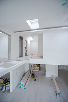 Worker Installing New Laminated Wooden Floor photo