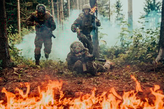 Modern warfare soldiers surrounded by fire fight in dense and dangerous forest areas photo