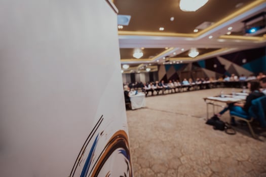 Blurred photo of the conference room where the business seminar is held