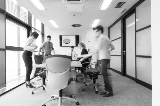 business people group entering meeting room  motion blur photo