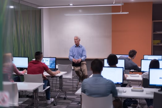 teacher and students in computer lab classroom photo
