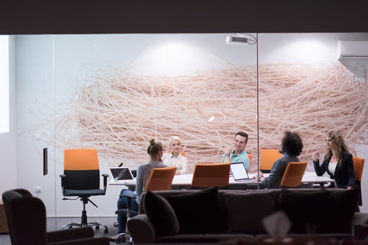 Startup Business Team At A Meeting at modern night office building photo