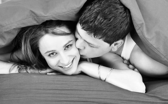 young couple in bed photo