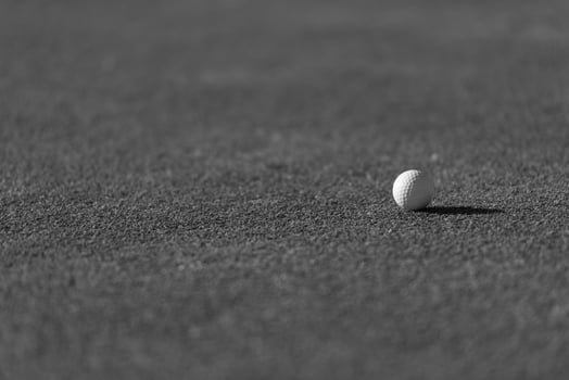golf ball on grass photo
