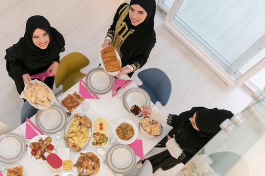 Young muslim women preparing food for iftar during Ramadan photo