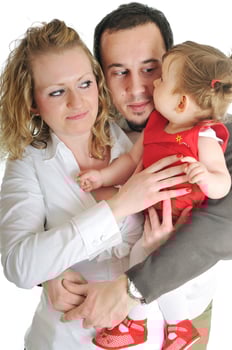 happy young family together in studio photo